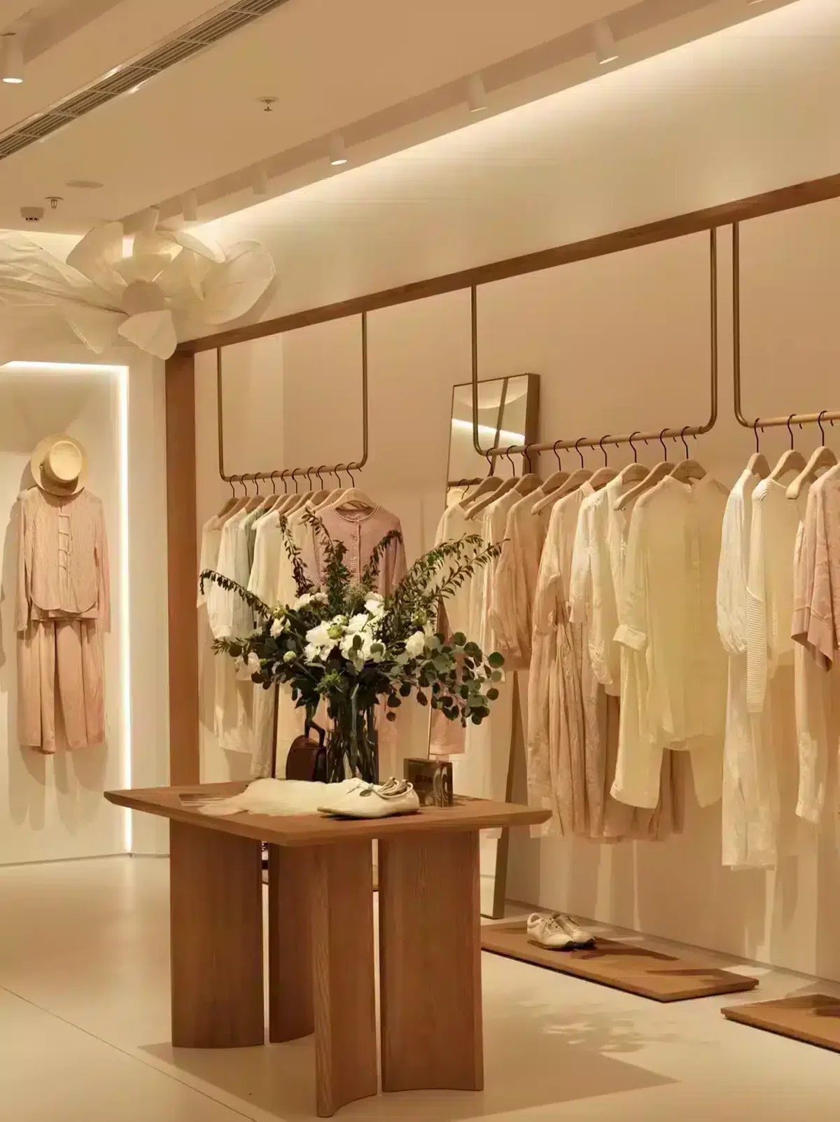 Fashion boutique with wooden fixtures and Fanan Display hangers