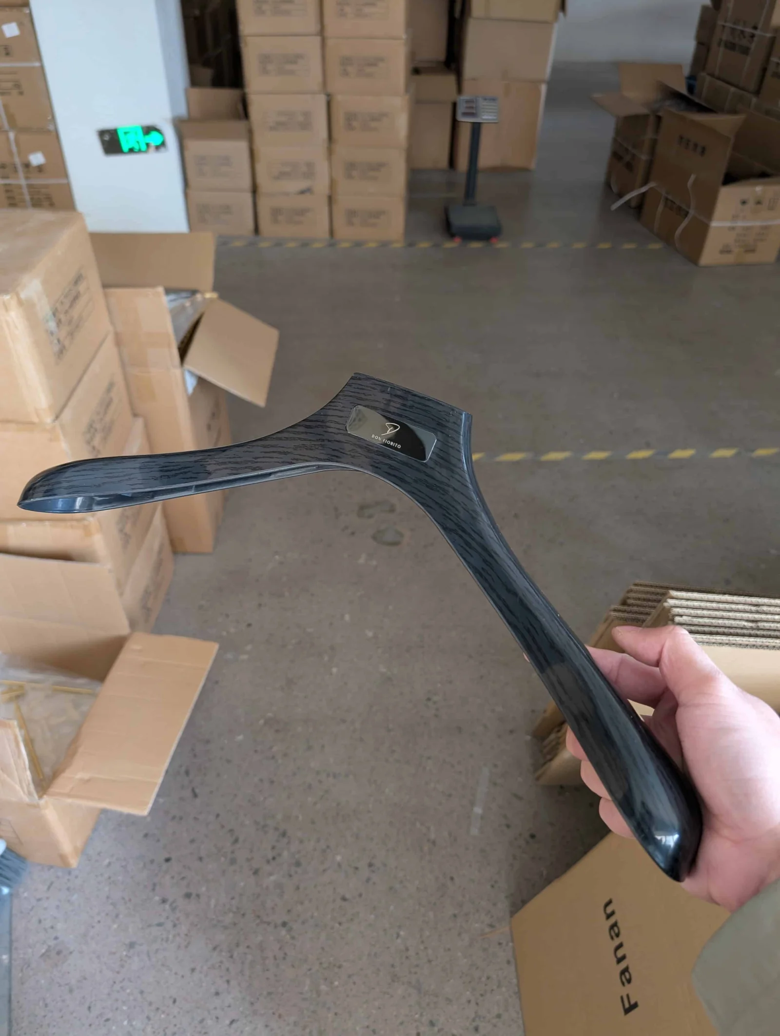 Black Wood Grain Hangers for a Dubai Suit Store